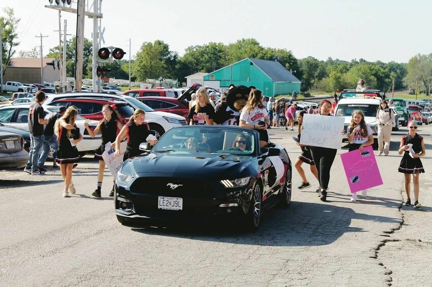 Conway's cheer squad in a Ford Mustang at last year's Community Days Parade.&nbsp;   Mail photo by Shelby Atkinson&nbsp;