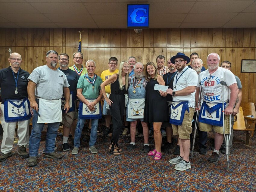 Webster Lodge #98 presents a check for $7,500 to the Marshfield Backpack Program.&nbsp;   Contributed photos