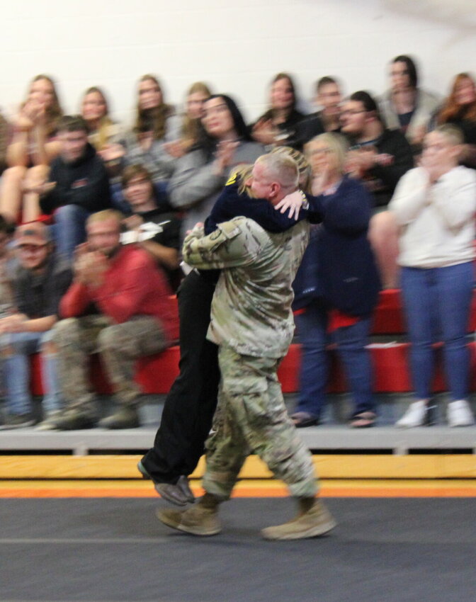 There were tears of joy and cries of cheer during Niangua's assembly on Nov. 10 as one soldier surprised his family after being deployed in Africa for 10 months. Senior Catherine Jennings rushed over during the announcement and embraced her brother-in-law as he greeted his family.   Mail Photo by J.T. Jones