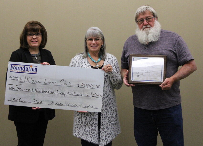 Webster Electric Office Manager Denise Holdman (Left) presented the Roundup Grants during the Distribution meeting on Nov. 2.   The first check was $10,942.50 and was given to the Elkland Lions Club, represented by Mona Whelan (Center), Vice President, and Steve Havener (Right), President. The funds will be used for constructing a new concession stand.   Mail Photos by J.T. Jones   &nbsp;