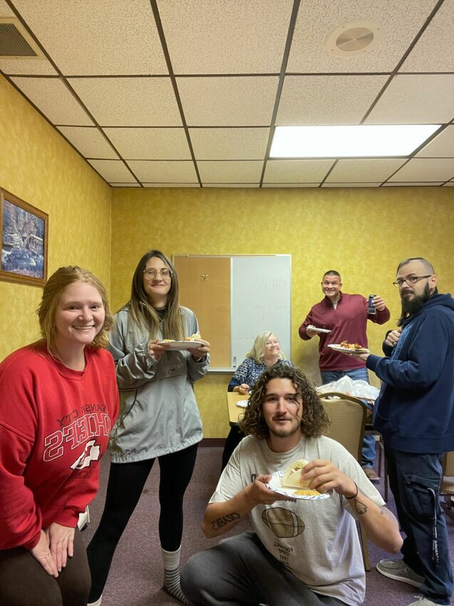 Marshfield Mail employees share a meal ahead of the Thanksgiving holiday.   Mail photo by Shelby Atkison
