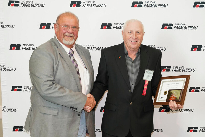 Webster County Farm Bureau leader Gary Don Letterman was presented with a plaque from MOFB Board member Duane Kaiser at the 2023 annual meeting at Lake of the Ozarks in December.   Contributed photo