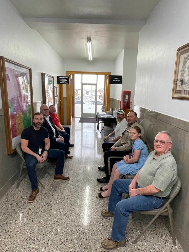 A line formed outside the Webster County Clerk's office Tuesday for the first official day of filing for the August Primary Election. Pictured on the left (front to back) is Webster County Assessor Austin Graybill, Northern Commissioner Dale Fraker, and Coroner Michael Taylor. Pictured right (front to back) is Surveyor Gary Drennon, Sheriff Roye Cole and Southern Commissioner Randy Owens.&nbsp;   Photo by Stacy Atkison