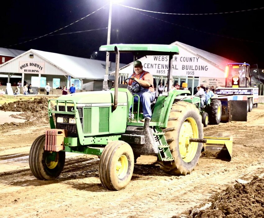 Volunteer Matt Manary pictured blading the track for the St. Jude Truck and Tractor Pulls over the weekend.   Photos by Julie Miller Manary