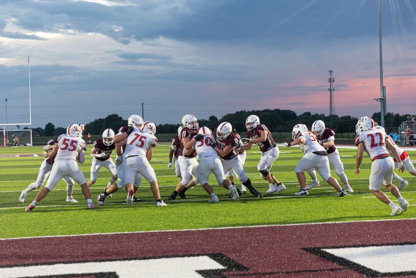 Logan-Rogersville defense works to tackle a Reeds Spring running back.


Photos by Greenbox Photography