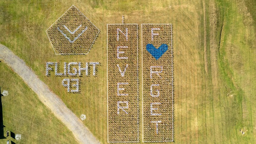The flag display contains 2,977 flags, representing the lives lost on 9/11.&nbsp;   Photo by John Quinn