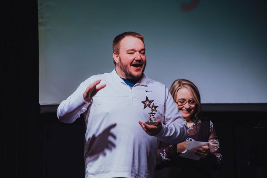 Clay Kenney pictured accepting the award for Most Positive Cast Member in the 2024 MCT production of Puffs.&nbsp;   Contributed Photo
