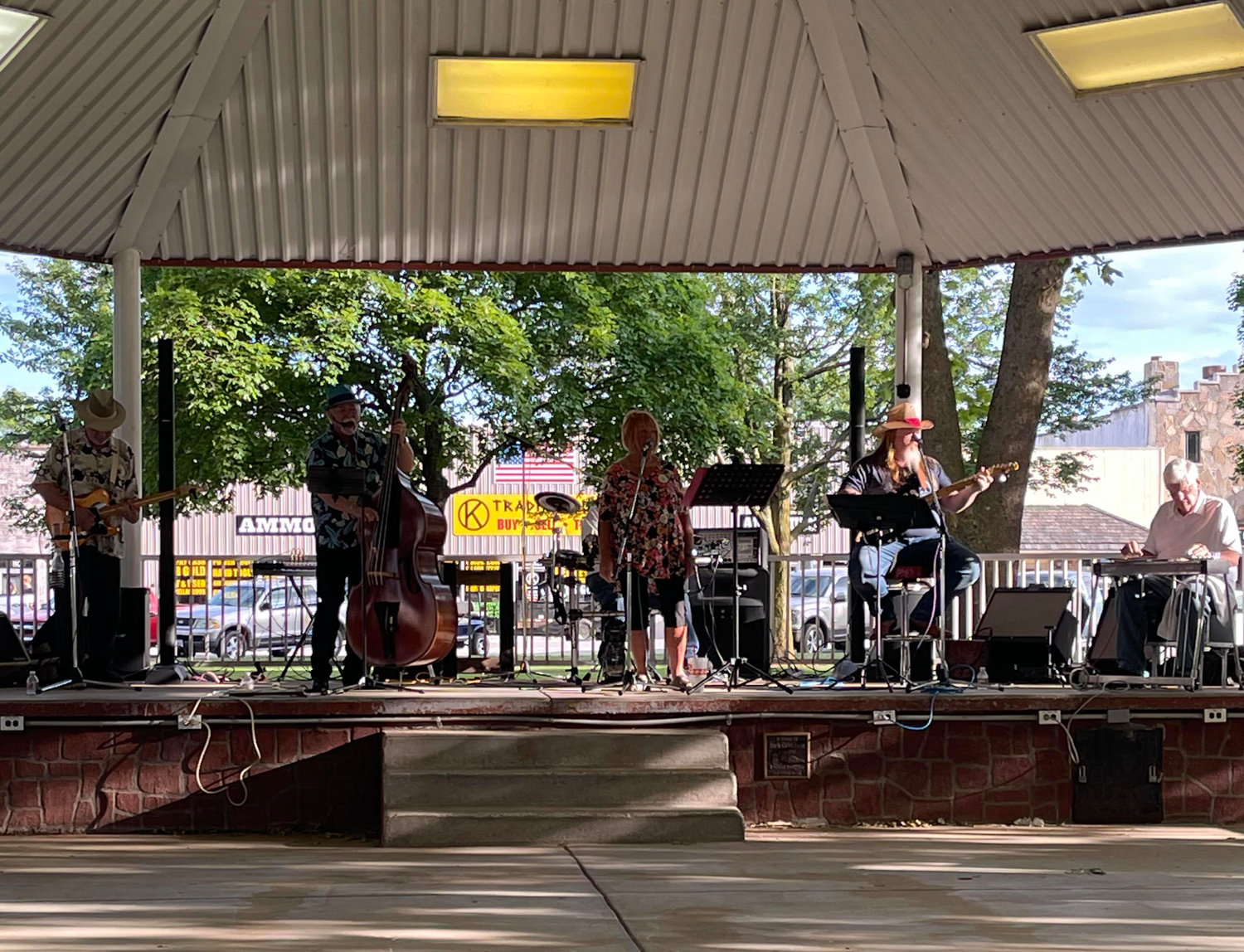 The Ozark Travelers performed under the pavilion on the square to provide entertainment for the benefit.