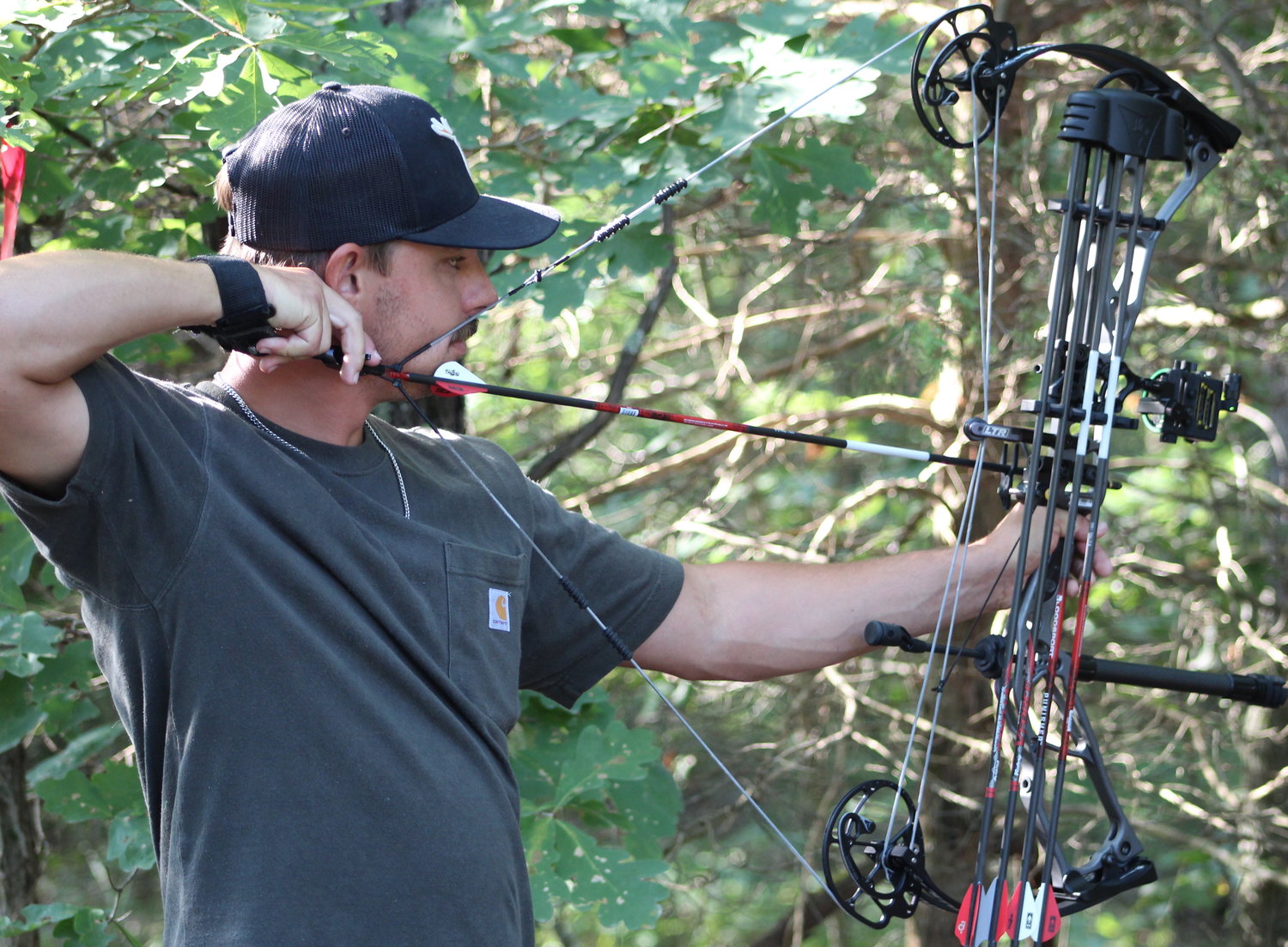 Hoping to get a perfect shot is  Casey, another archer seen at the event prepares his shot. He is just one of the nearly 850 people that participated in the bowshoot this Saturday.
