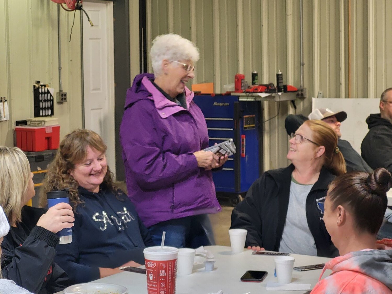 Showing just how 'sweet' she can be, Jo Jones passes out chocolate bars to all her fellow drivers during her retirement party.


Mail Photo by John "J.T." Jones
