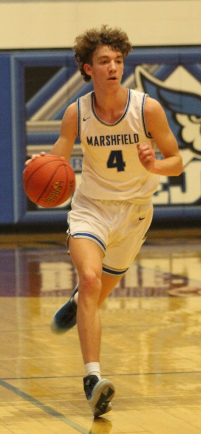 Sophomore Tegen Curley runs down court and would score a total of 13 points in Marshfield's opening game against Forsyth.