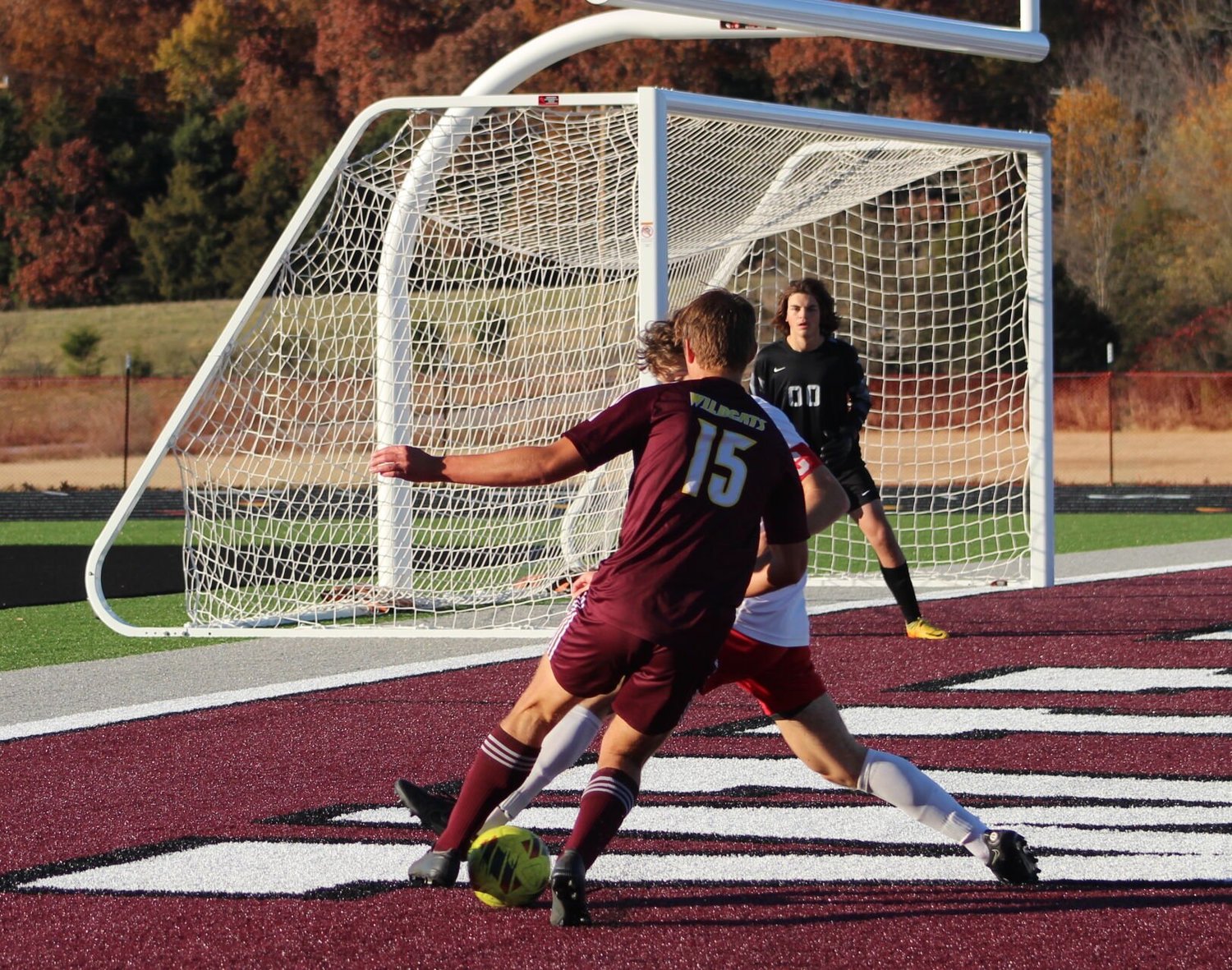Weaving through the Bulldogs is Sophomore Marcus Sirb, scoring the first goal of game.