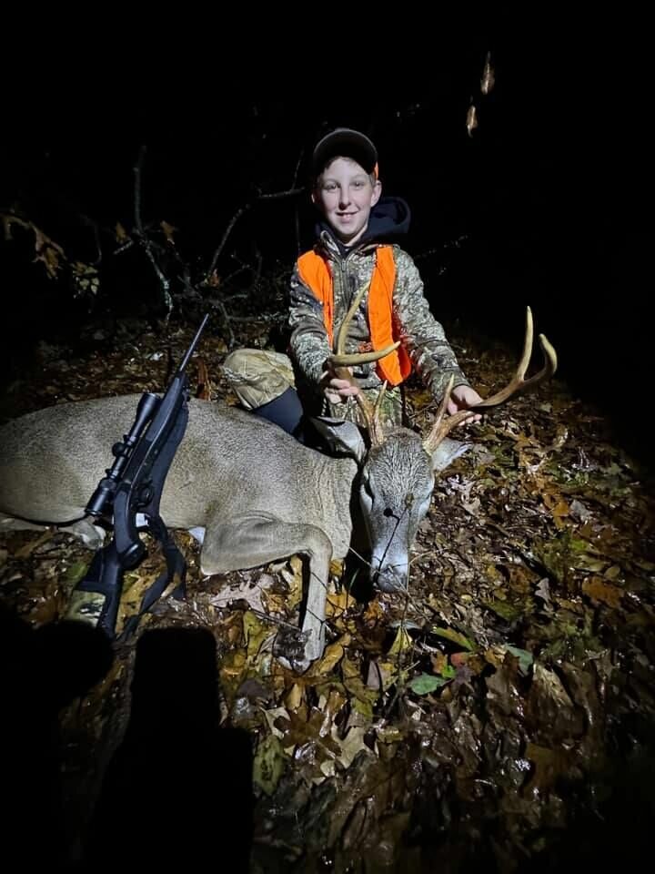 Garrett Mason poses with the 6 point buck he harvested in Webster County.