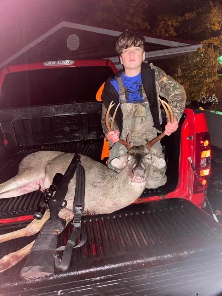 13-year-old Lincoln Aikins, of Marshfield, poses with his first buck. Lincloln used a .308 during the hunt. 
 

  