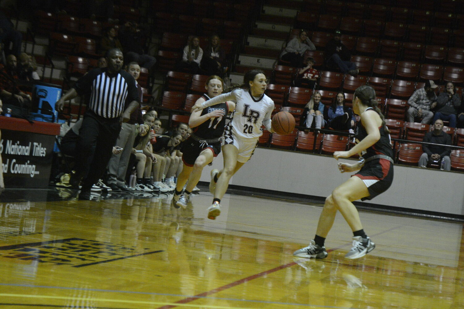 Senior Sienna Clark takes it up the court for the Lady Cats on Saturday, Dec. 30 against Aurora. Rogersville lost 50-40.