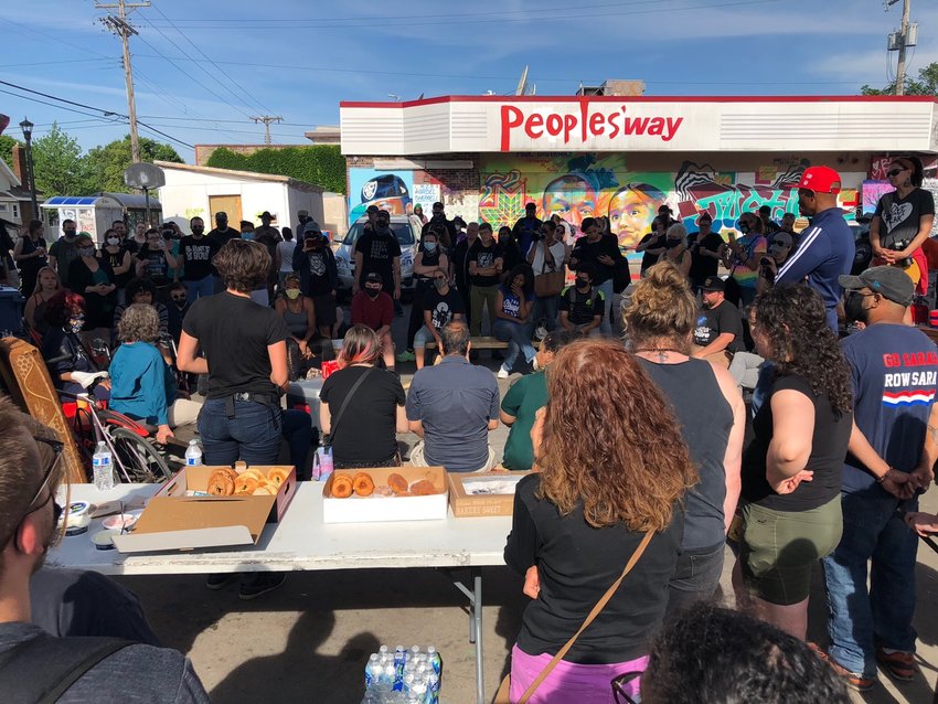 The morning meeting at George Floyd Square was packed  after the city pulled up its cement barriers during the early hours of June 3; within hours, makeshift barricades were placed by community members at each of the four entrances to the intersection.