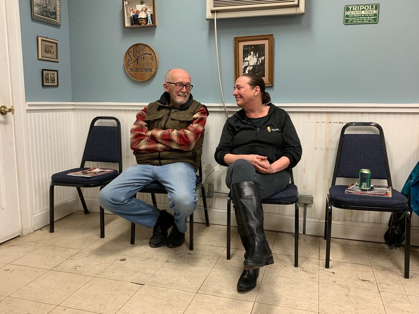 Barber Kristin Ohnstad (right) became the proprietor of Bob&rsquo;s Barber Shop when her father, Bob, retired 11 years ago. She is selling to move out west. (Photo by Sue Filbin)