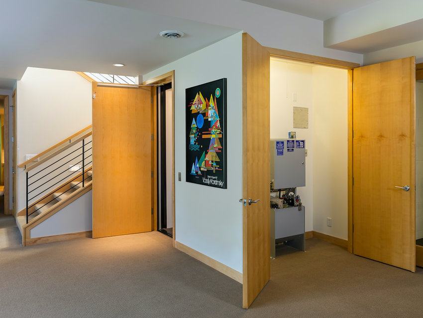 Installing a small elevator and widening doorways made this lower level more accessible. (Photo by Andrea Rugg Photography)