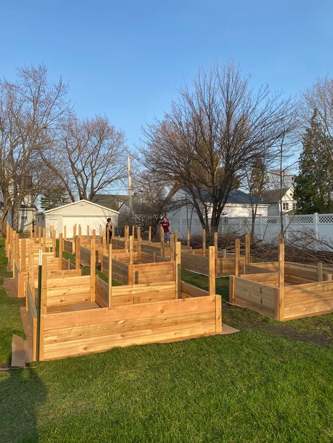 Volunteers build and tend raised garden beds at the Giving Garden at Trinity Lutheran Church. Food grown will be donated to a food shelf.