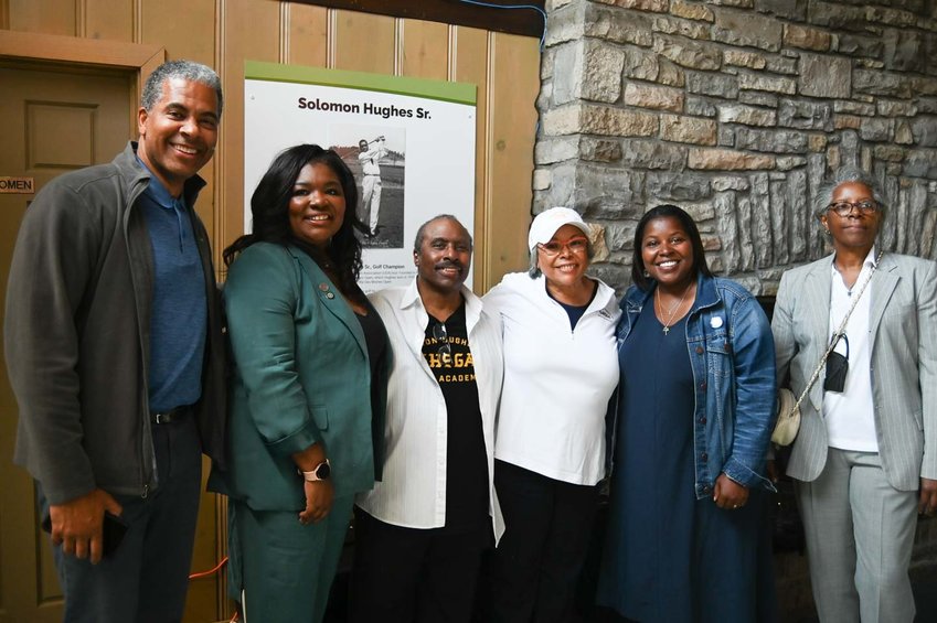 The clubhouse at Hiawatha Golf Course has been renamed. Celebrating on June 29, 2022 are (left to right) MPRB Superintendent Al Bangoura, Minneapolis City Council Member LaTrisha Vetaw, Solomon Hughes Sr.&rsquo;s children Solomon Hughes Jr. and Shirley Hughes, MPRB Vice President Alicia D. Smith and Solomon Hughes Sr.&rsquo;s granddaughter Roxanne Allen.