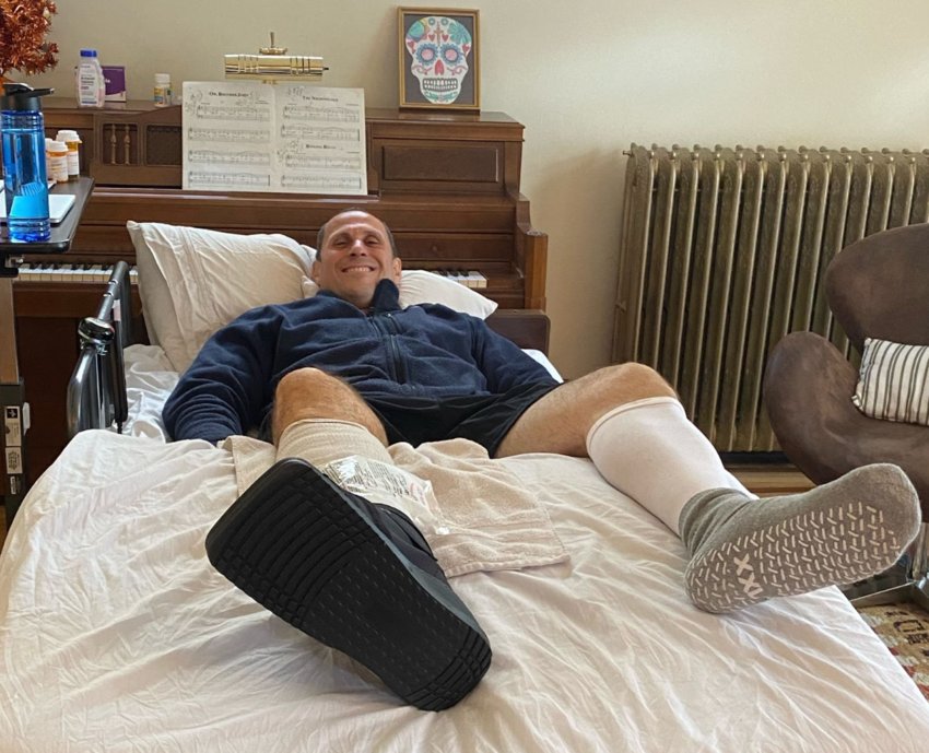 Eric Ortiz, the author, resting at home after total ankle replacement surgery.