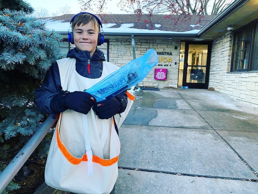 Carrier Axel Pettit delivers to the YMCA in Standish at the corner of 28th and 41st in the Messenger's expanded territory. The new area adds 2,000 residences to the area that receive papers direct to their front doors.