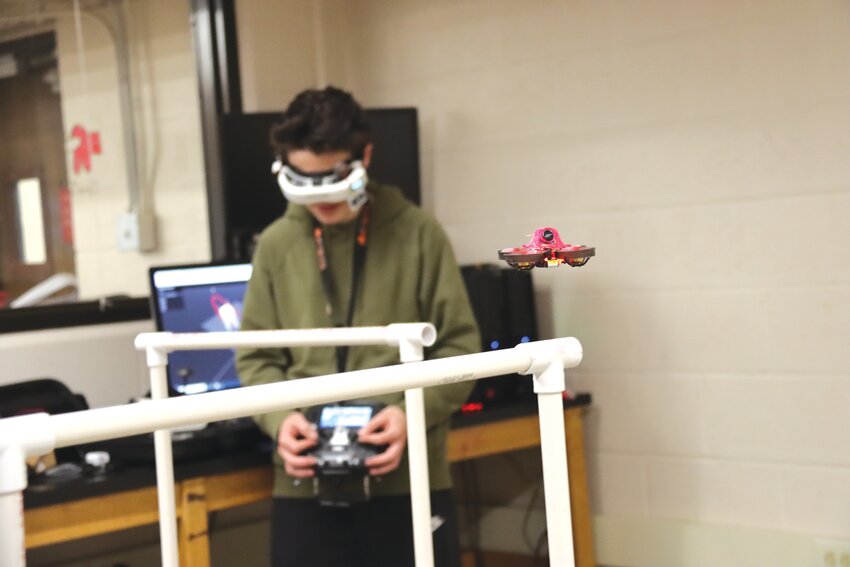 Washburn Racing Drone Team member Alex Pasdo maneuvers his eight-centimeter-wide Tiny Whoops drone through a course after school, learning skills he can apply to real-world jobs.