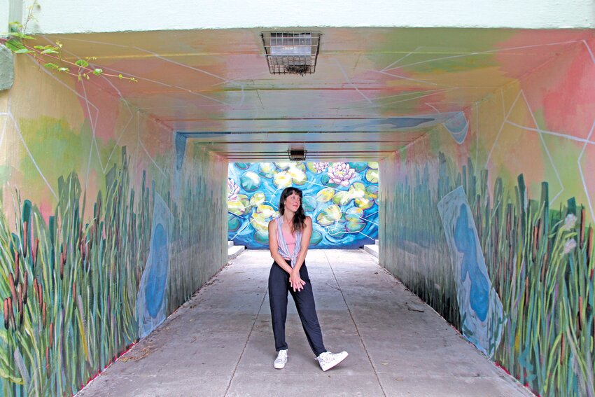During design for a mural at the Lake Harriet trolley tunnel, Jacqui Rosenbush researched water quality control. She included lily pads and cattails in her mural after discovering the large role they play in filtering water.
