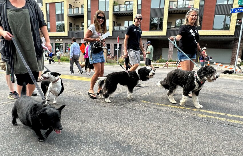 Volunteers are key to pulling together the annual Woofstock event in Linden Hills.  The energy they put into the community event helps it run smoothly.
