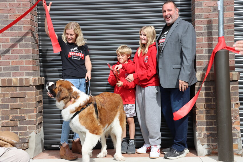 &ldquo;Here&rsquo;s to the next 48 years,&rdquo; said South Lyndale Liquor owner Dan Campo as his two children, the future of the family-owned business, cut the ribbon at their new 35,000-square-foot building at 5516 South Lyndale Ave. on Oct. 4, 2023. Left to right: Kate, Roman (age 9), Sydney (age 15) and Dan Campo.