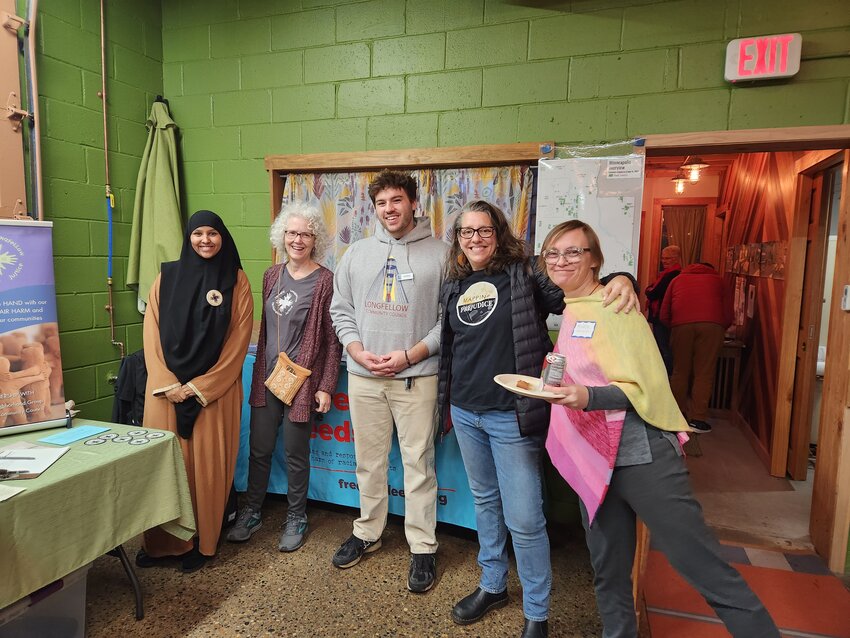 Neighbors gathered for pizza and conversation at the Longfellow Community Council annual meeting held at the Toolbox Collective. This year's event presented a new take on the traditional &quot;pie&quot; theme by serving pizza pie instead of dessert pie. (Photo submitted)