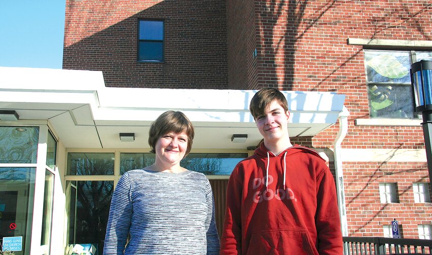 Vilma Alkhas, principal of the school with her son Marduk, student at the Lithuanian Heritage School outside of Minnehaha United Methodist Church.