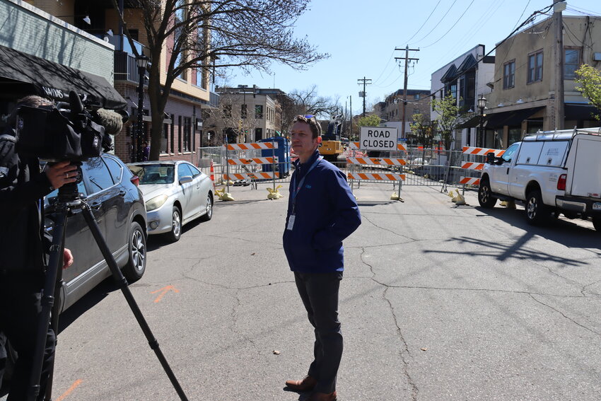 Drew Kerr, a Linden Hills resident who works for Met Transit, stands near the closed main intersection at Upton and 43rd. It will be fully closed for about  10 weeks as the city completes a water and sewer project at the same time as Met Transit does work on the E Line. After the city’s work is finished, the intersection will be partially closed. Local businesses have maps available to show where customers can park.
