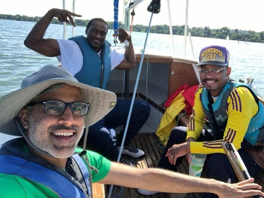 Vikas Narula (left), George Floyd (center), and Alvin Manago (right) on the free Third Sunday Sailing event in August 2019. (Photo submitted by Vikas Narula)