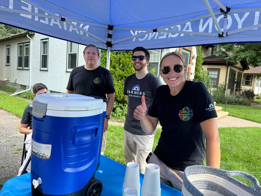 Nokomis East Business Association (NEBA) Vice President Natalie Lyons staffs her tent and gives away water and gelato during the first day of the three-day festival on Friday, Aug. 2, 2024.