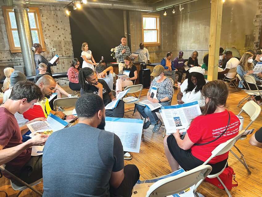 Attendees review materials at the city&rsquo;s third visioning workshop held at The Square event center on July 23. (Photo by Jill Boogren)