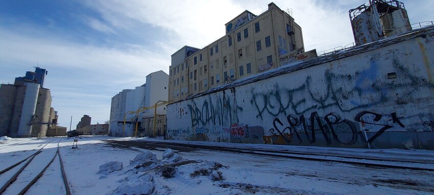 The Nokomis Mills and Elevators at 3501 Hiawatha Ave. are owned by ADM Milling Company and may be torn down to build housing. In 2010, the the Ralston-Purina feed mill on the southeast corner of 38th and Hiawatha was razed and replaced by the 180-unit Longfellow Station project. Through a mix of historic and affordable tax credits, Dominium remade the historic millwork at 4041 Hiawatha into Millworks Loft housing units, which opened in July 2017. (Photo by Gabe Gordon)