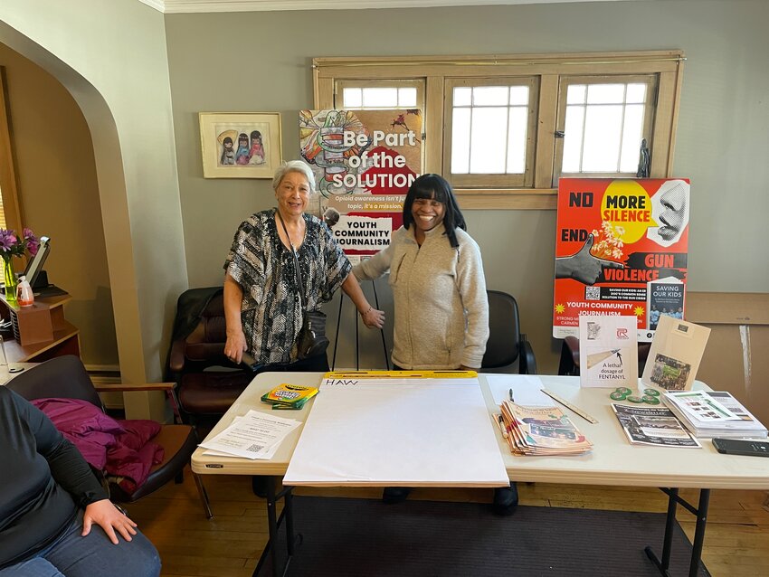 Twin Cities community leaders Carmen Robles, left, and Diana Hawkins at a community event in the Hawthorne neighborhood of north Minneapolis. (Photo by Eric Ortiz)