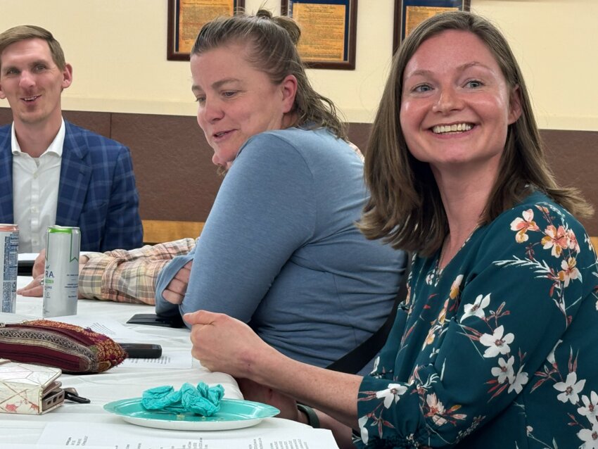 At the Nokomis East Business Association (NEBA) annual meeting on April 16, Nokomis East Neighborhood Association (NENA) board chair (center) Christina Meyer gave an update: announcing that Sarah Friedman (right) had just been hired as the new NENA Executive Director. (Photo by Tesha M. Christensen)