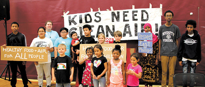 The Minneapolis City Council hasn't allowed these kids or those in support of a farm at the Roof Depot site to speak, so they gathered together on June 17 to flood city council member offices with phone calls sharing their ideas for what they want in their community. (Photo by Tesha M. Christensen)