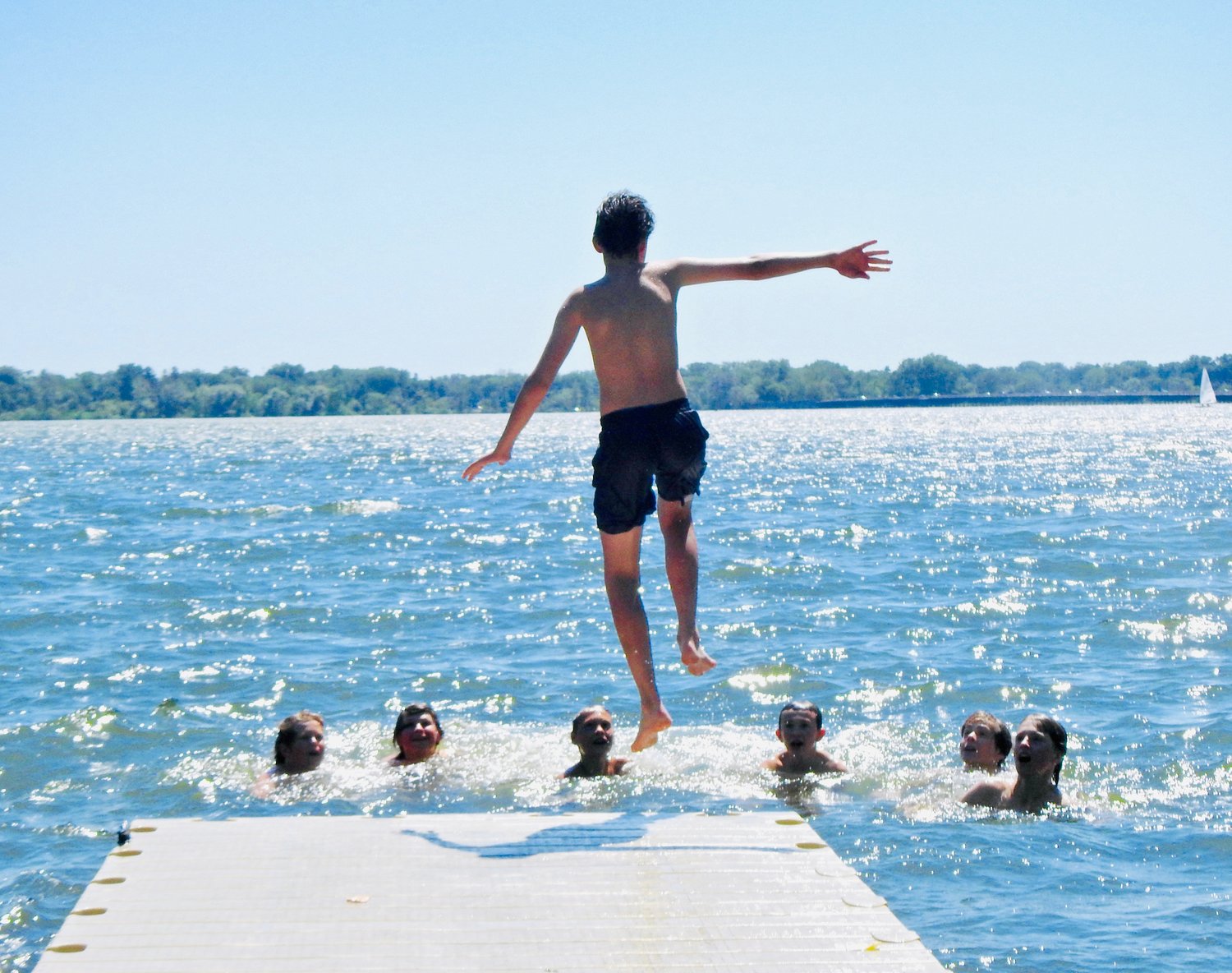 Kids cool off in Lake Nokomis on a sweltering hot day, capturing the joy of summertime in this reader submitted photo by Dallas Crow.