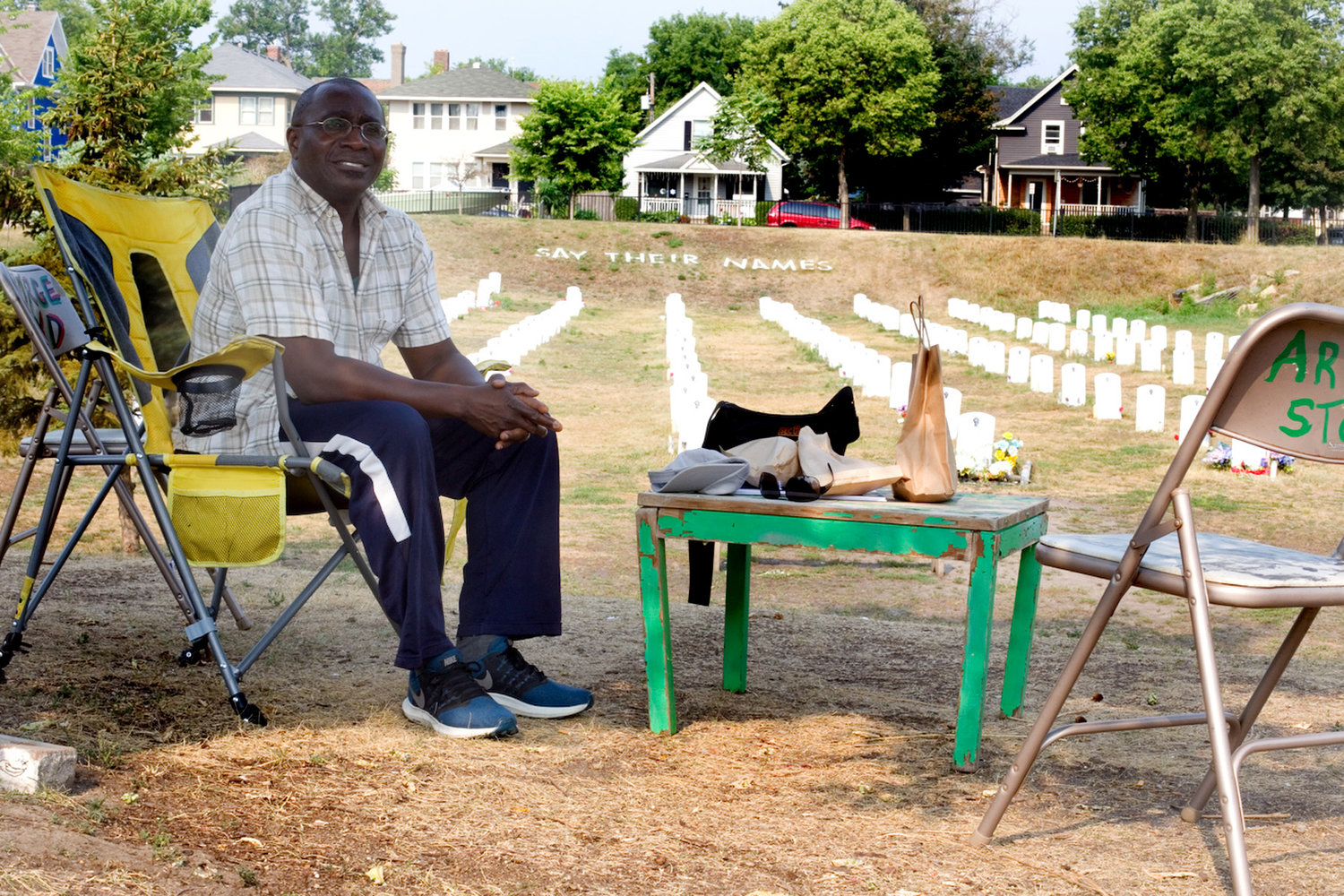 “For me, this is the most peaceful place on earth," explained Dr. Remi Douah, who is a listening presence at the "Say Their Names Cemetery" near George Floyd Square. "I can easily spend eight hours a day here. It’s not a chore; it’s not an intervention. It’s my way of life now. It’s what I structure my days around.” (Photo by Margie O’Loughlin)