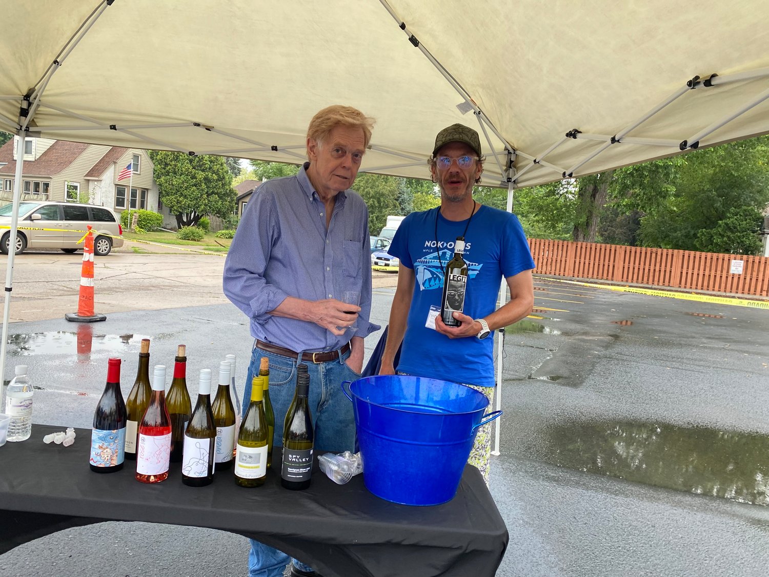 Tom Gill of New France Wine Company (left) and Nick Daugherty of McDonald's Liquor during the beer and wine tasting event at McDonald's on Saturday, Aug. 7.
