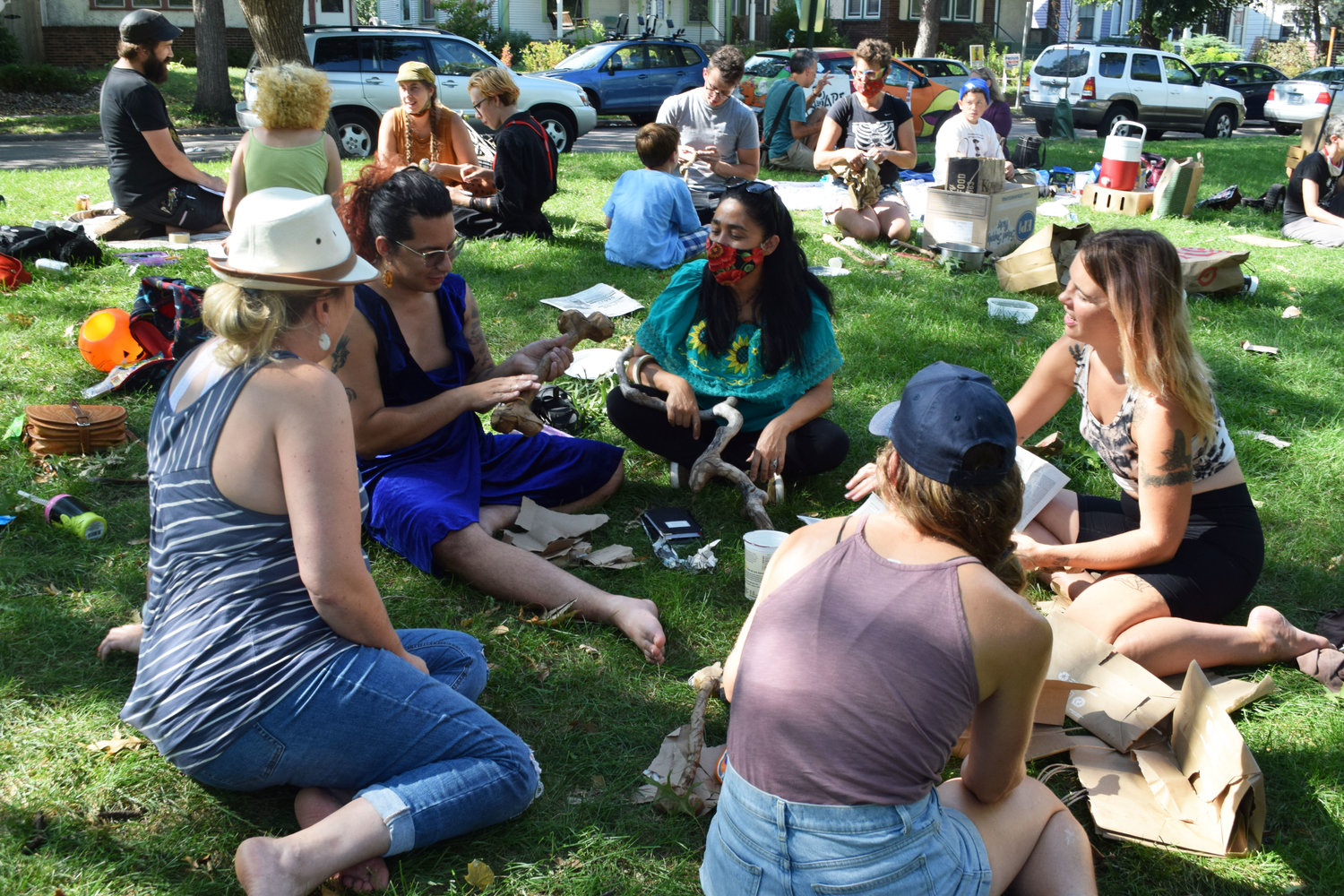 Community members create bones and other sculptures together at Powderhorn Park on Sept. 19. Gatherings are open to the public and are held every Sunday, from 1-3 pm near the 10th Ave. and 33rd St. playground entrance, until the Extravaganza. (Photo by Jill Boogren)