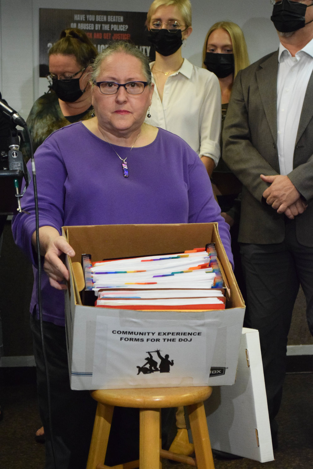 Communities United Against Police Brutality President Michelle Gross shows a box filled with nearly 1,100 stories of people’s experiences to be submitted to the Department of Justice in their ongoing investigation of the Minneapolis Police Department.