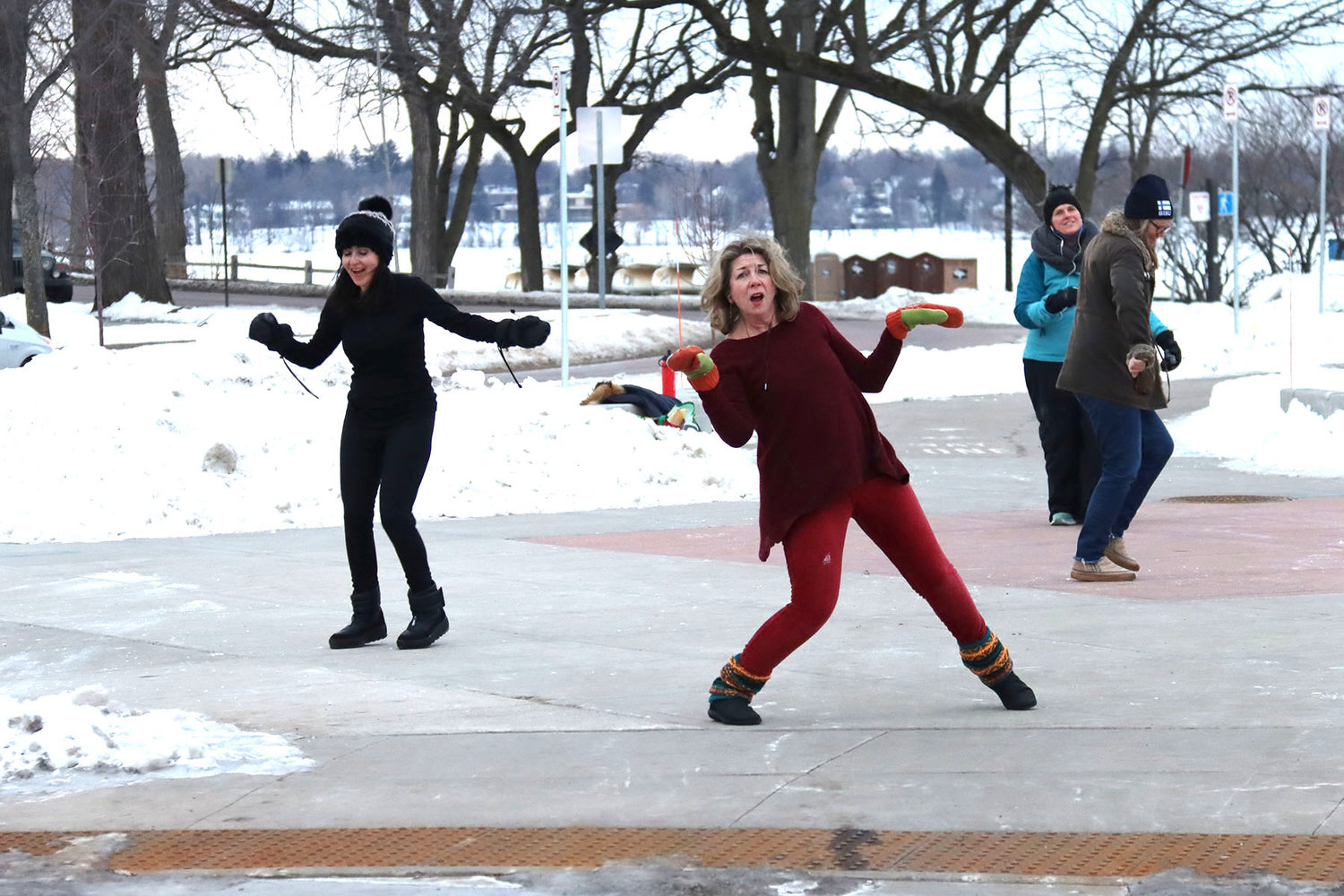 Nan Marie Zosel of Kingfield is energized by dancing with others at the corner of Bde Maka Ska Boulevard and Lake Street