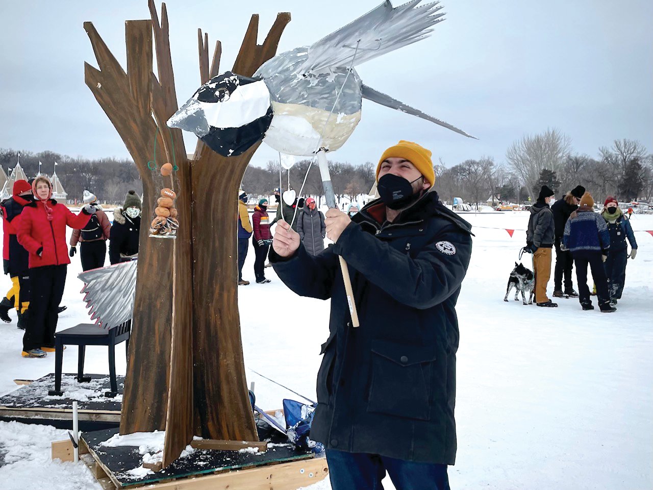 Artist Daniel Demarco entertains festival-goers with one of several larger-than-life bird puppets  featuring species that winter in Minnesota. (Photo by Susan Schaefer)