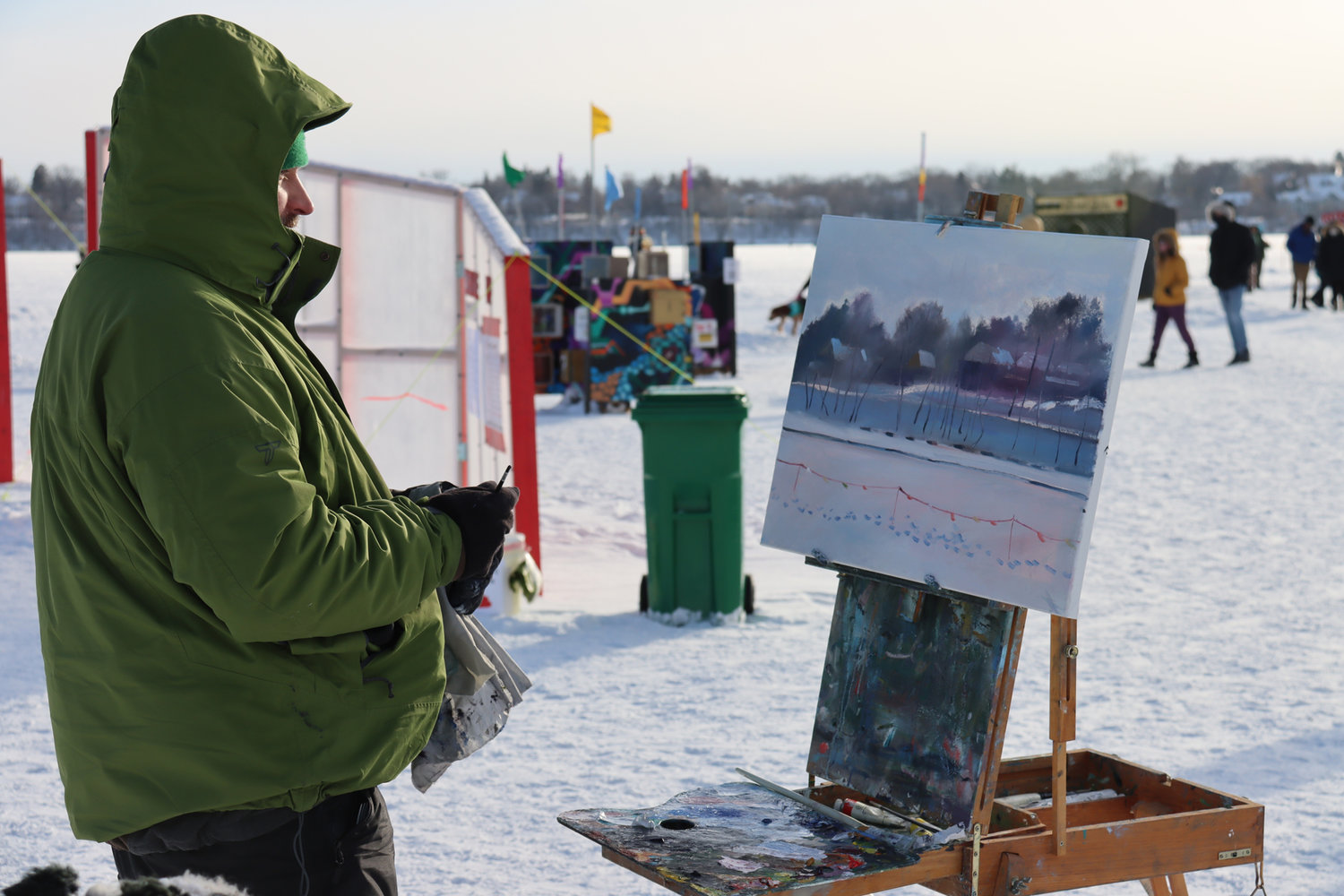 Tadas Kosciuska paints on-ice at Bde Unma /Lake Harriet for the first time on Sunday, Jan. 23, 2022. He’s a member of the Outdoor Painters of Minnesota, which arranges group paint-outs at scenic locations. (Photo by Tesha M. Christensen)