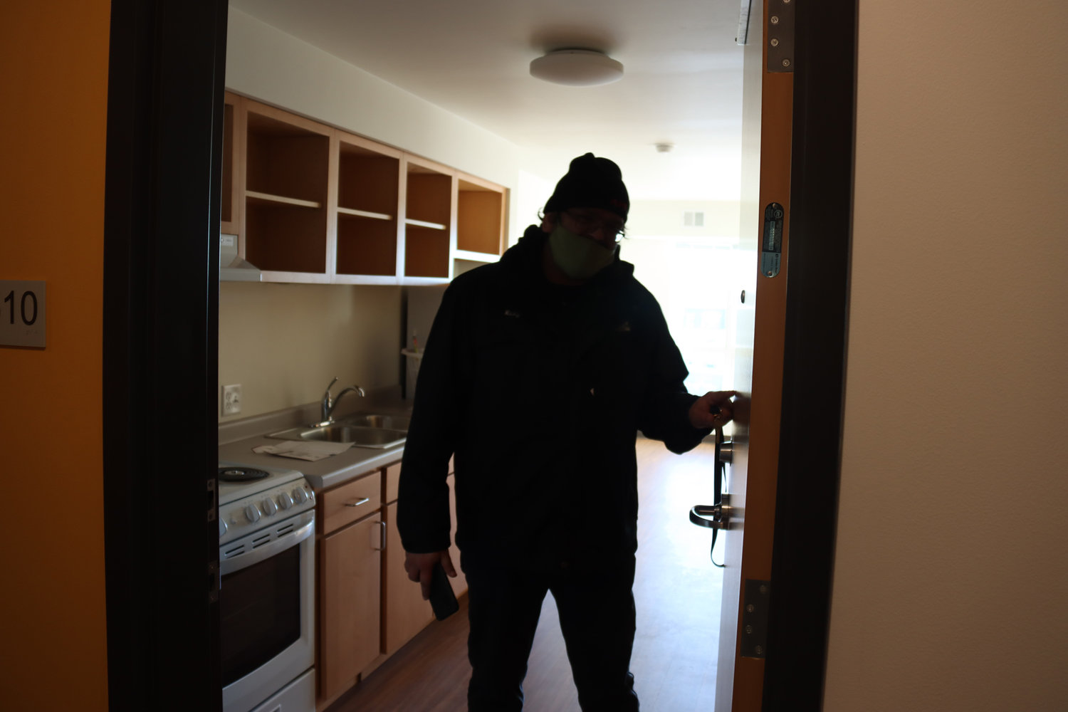 Ricky Rains signed the lease agreement on Jan. 19, and planned to start moving stuff in the next day before his weekend night shifts began. His favorite things about his new apartment? The large walk-in closet and sliding barn door.
