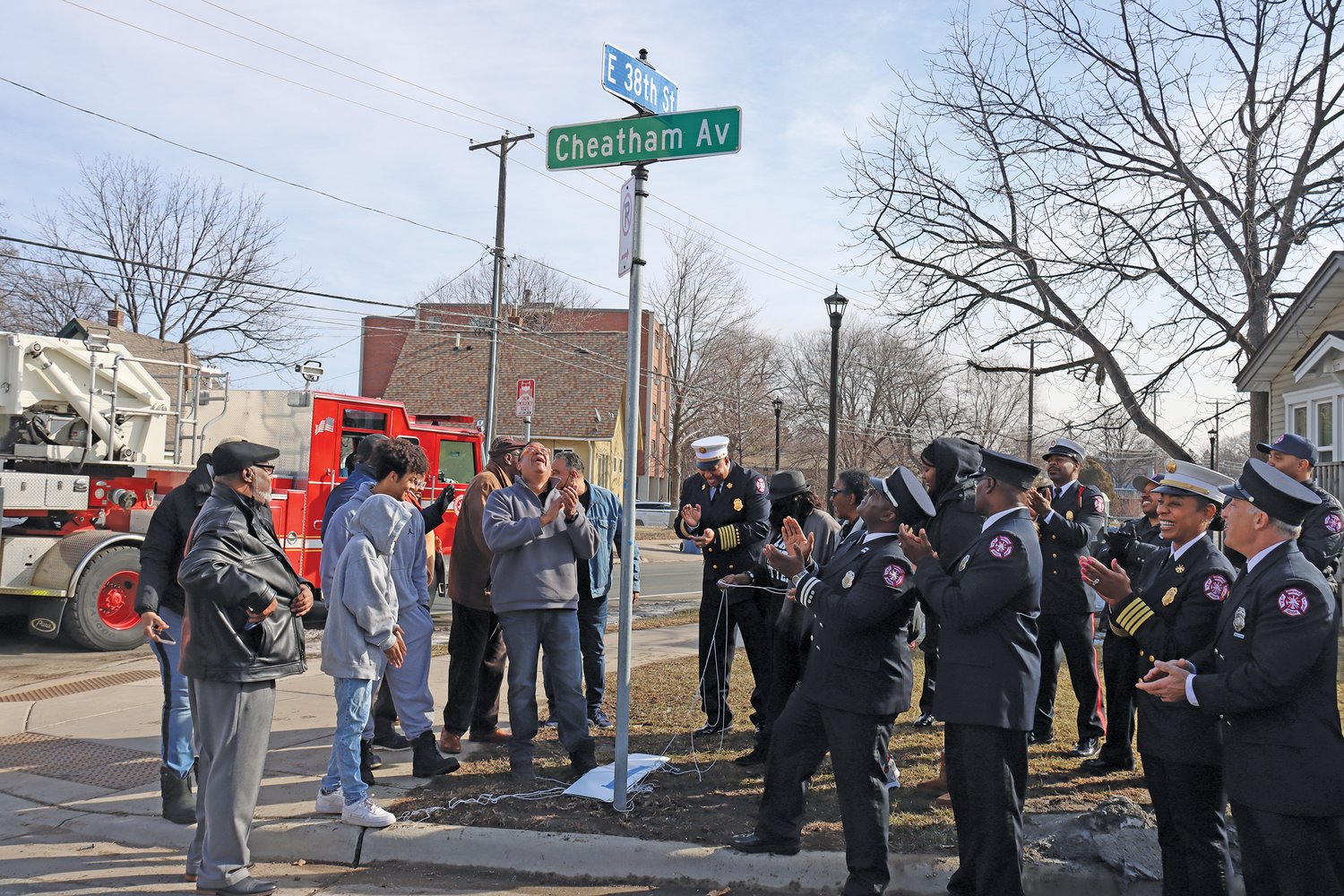 The descendants of John Cheatham, the city’s first Black fire chief, local leaders, and members of the African American Firefighters Association gather to rename Dight Ave. on March 17, 2022. (Photo by Tesha M. Christensen)